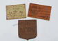 El PVC TPU de Brown cosió en las etiquetas de cuero del cuero repujado del SGS de la etiqueta de los vaqueros